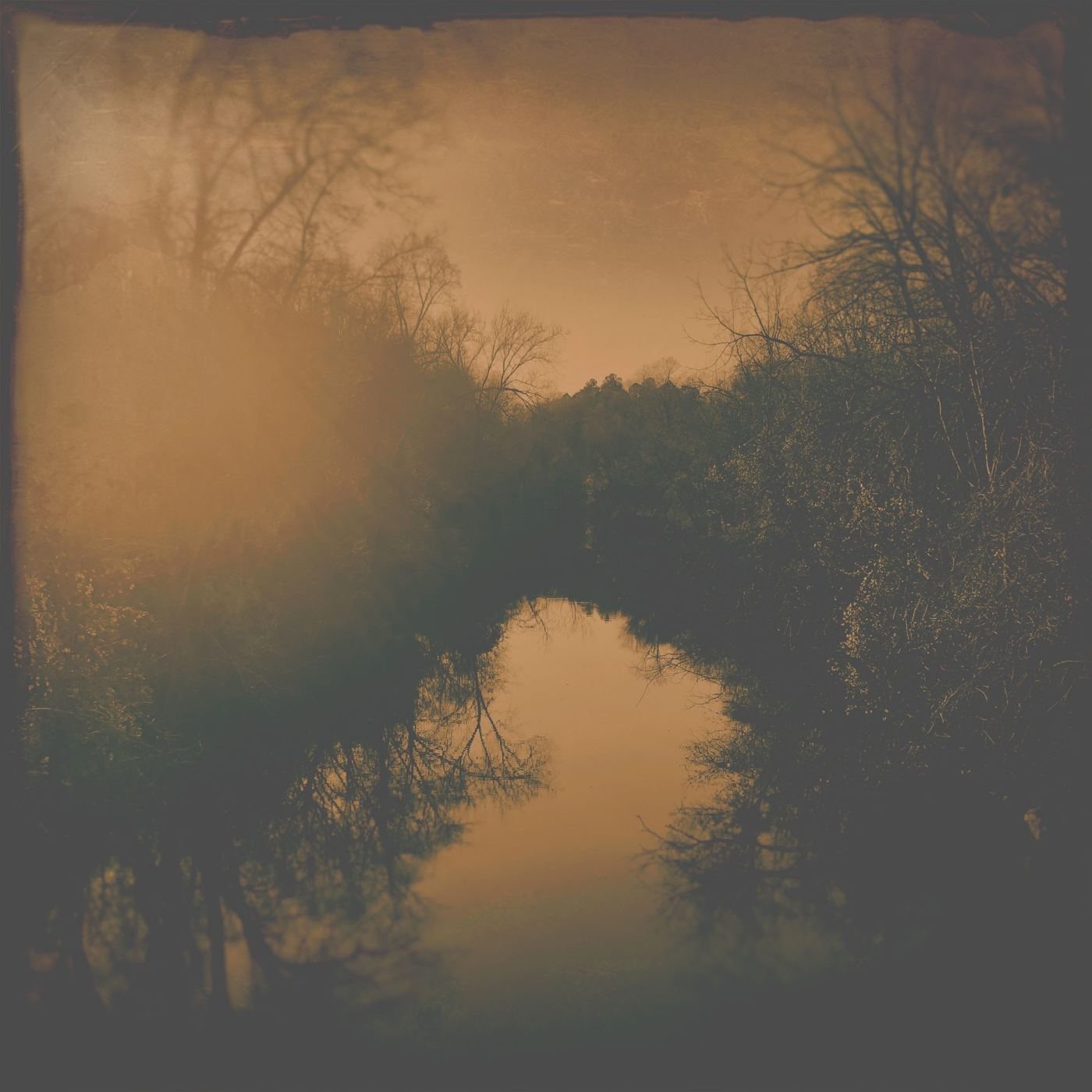 The misty river in amber light